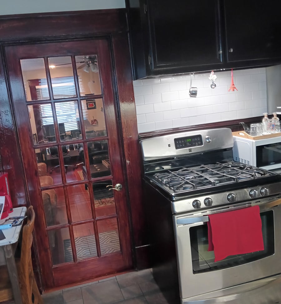 More charm - original glass paned door. Cabinet space above for pots & pans.