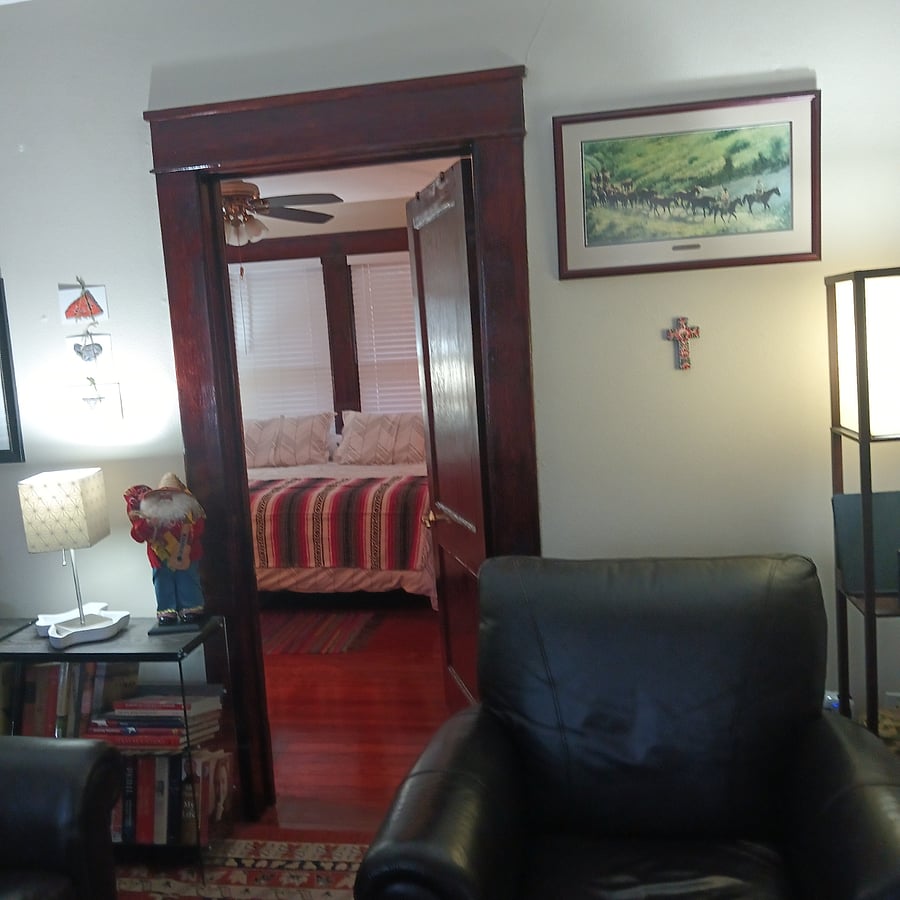 Door from living room into the front guest bedroom.