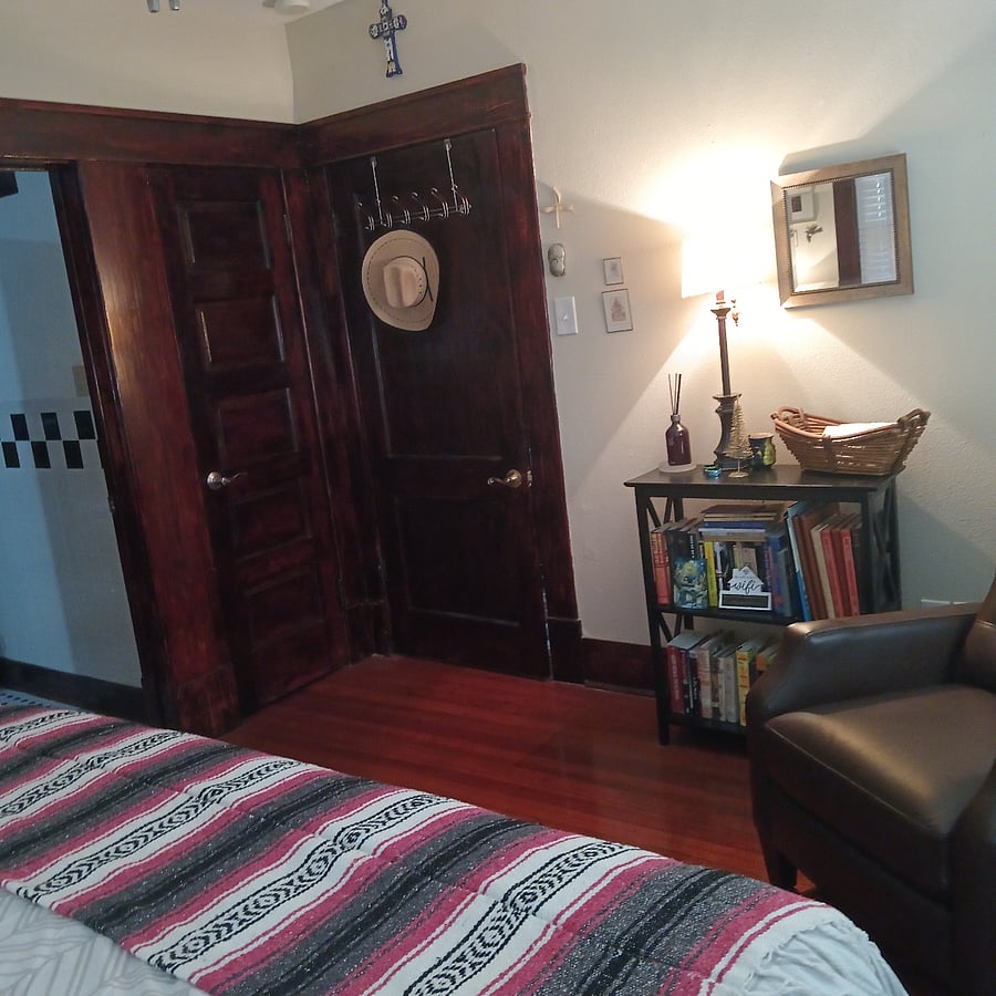 Door from front guest bedroom leading into the living room. Side door leads into the guest bathroom. The 3rd door is for the closet