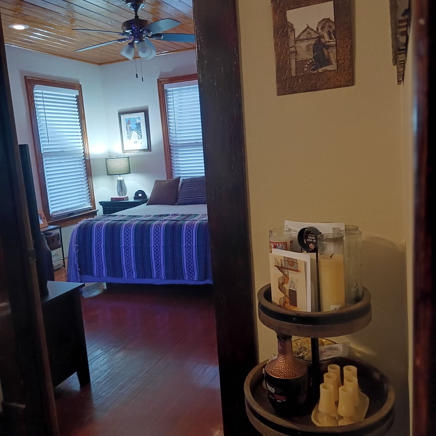 Looking into the master bedroom. This room has beautiful wood paneling.