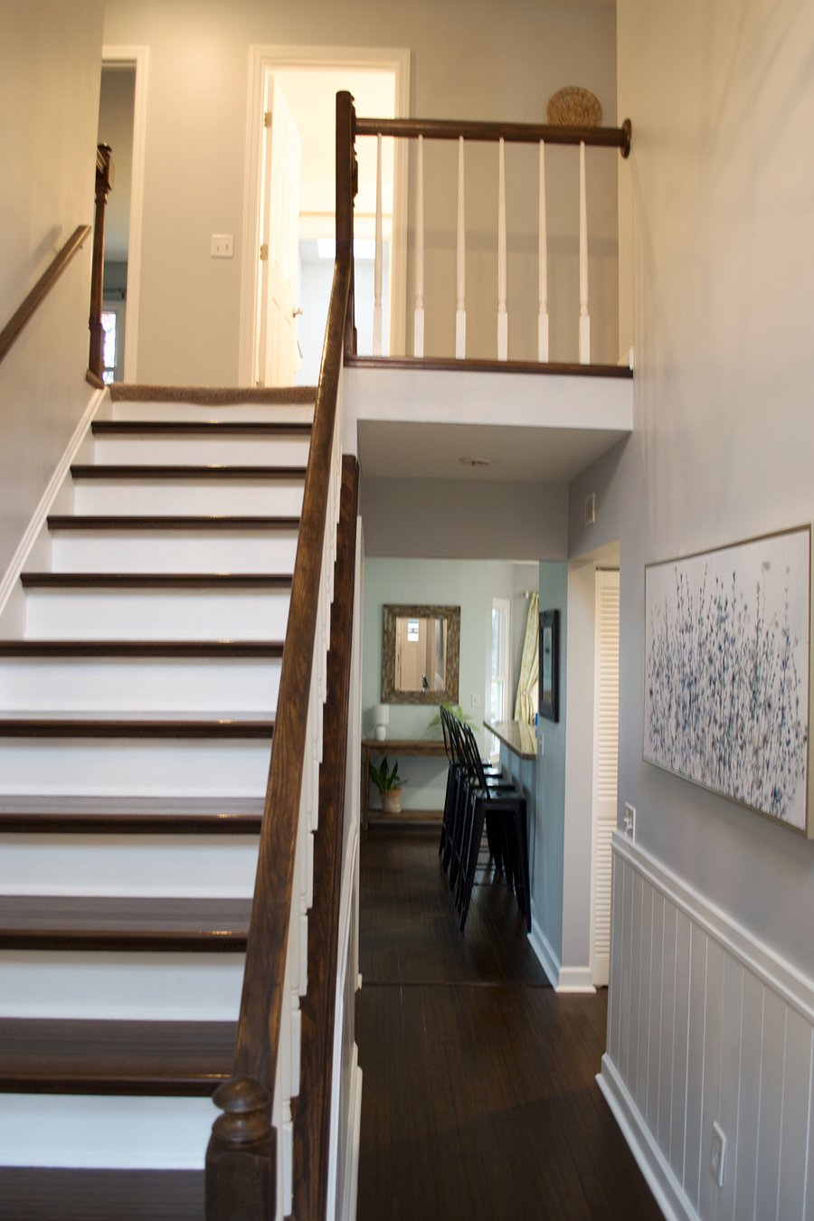 Two story entry way with option to go upstairs, enter the dining room, living room, or kitchen and family room.