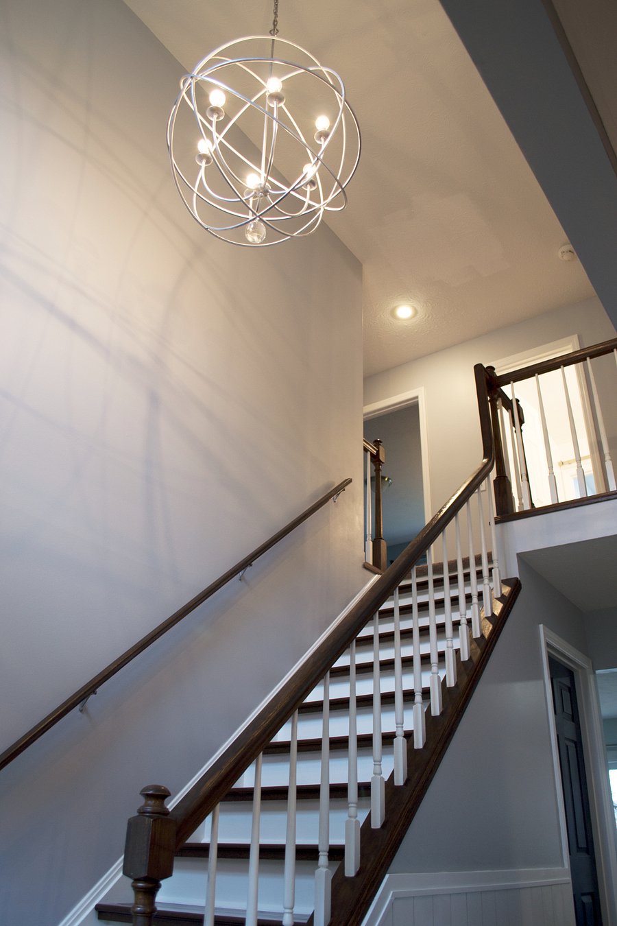 Stairway leading to four bedrooms and 2 full bathrooms.