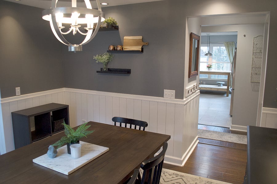 Dining room looks into the kitchen with a passthrough space to place dishes.