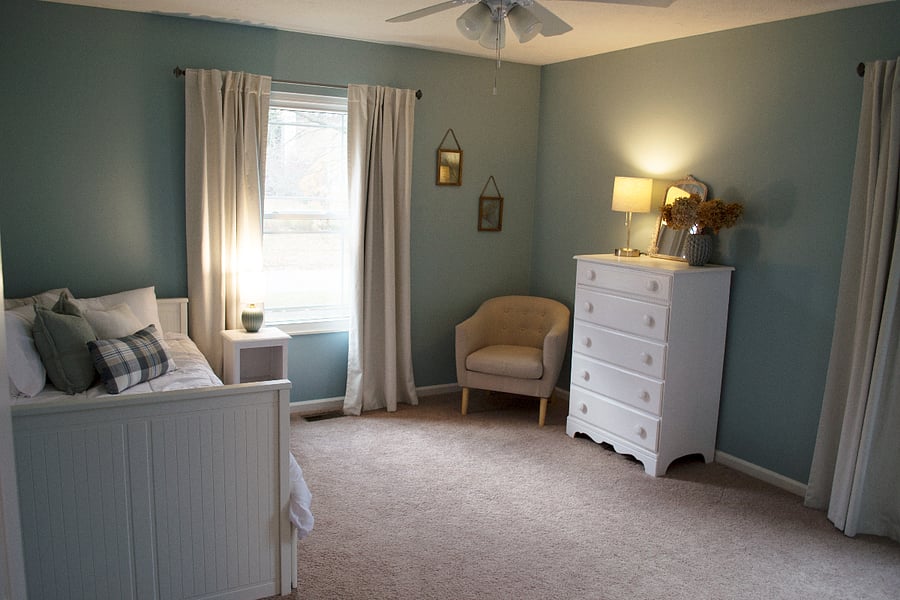 The second bedroom is adjacent to the first bedroom and right next to the hall linen closet. This bedroom has a twin bed that pulls out into a king bed with storage underneath. There's also a dresser and full closet.