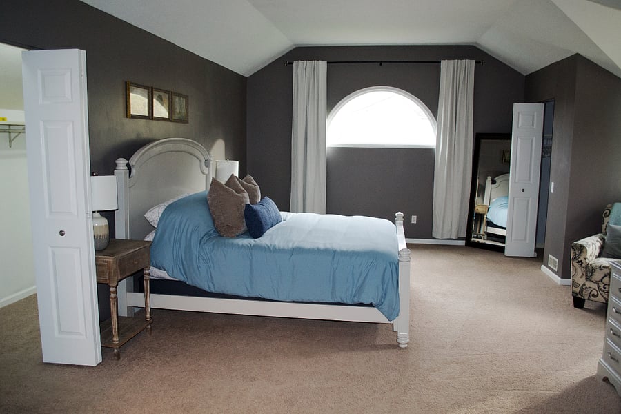 The primary suite (4th bedroom) is at the end of the hall and features 10 foot ceilings with gorgeous windows.
