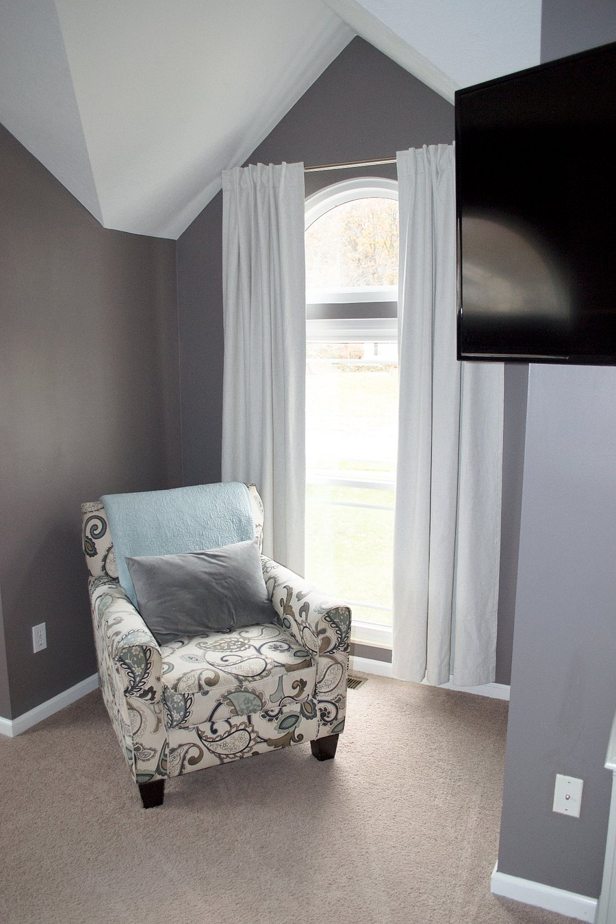 The window nook in the primary bedroom is the perfect place to drink your morning coffee.