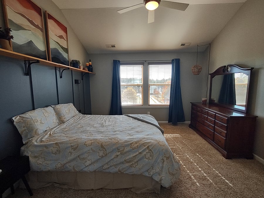 Master bedroom with full dresser and cozy decor