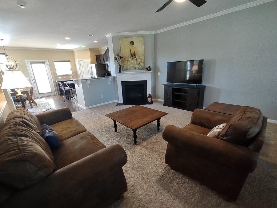Living room with smart TV and gas fireplace
