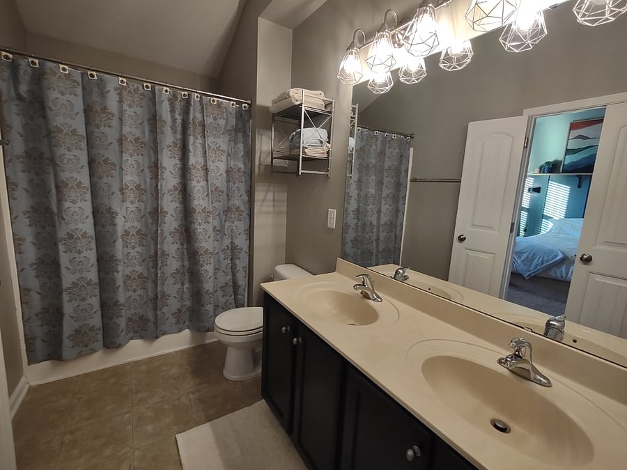 Master full bathroom with two sinks and soaking tub