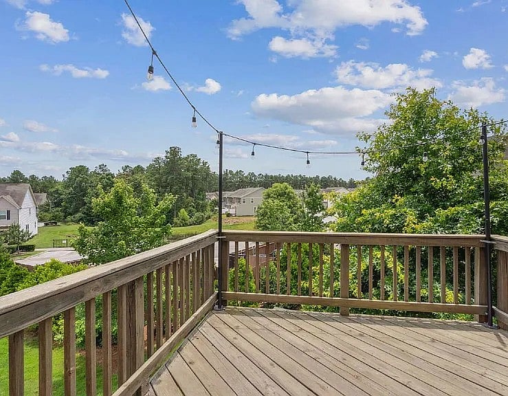 Deck with string lights off of main level / kitchen
