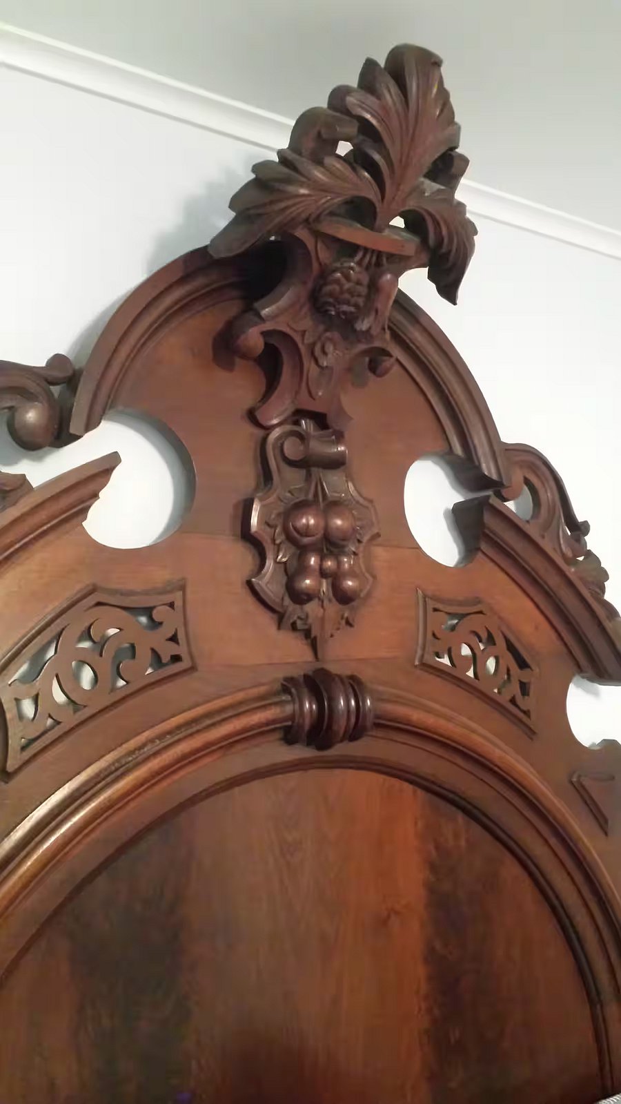 Close-up of antique bed carvings.
