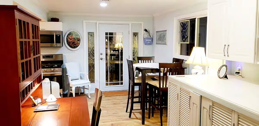 Dining area, door leading to your deck. Kitchen to the left. Left side of kitchen, refrigerator