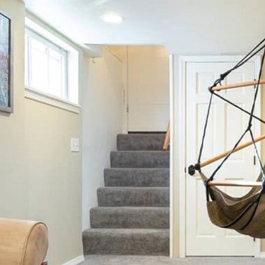 View of stairs leading into Artist's Underground (Sky chair now located in shared backyard area)