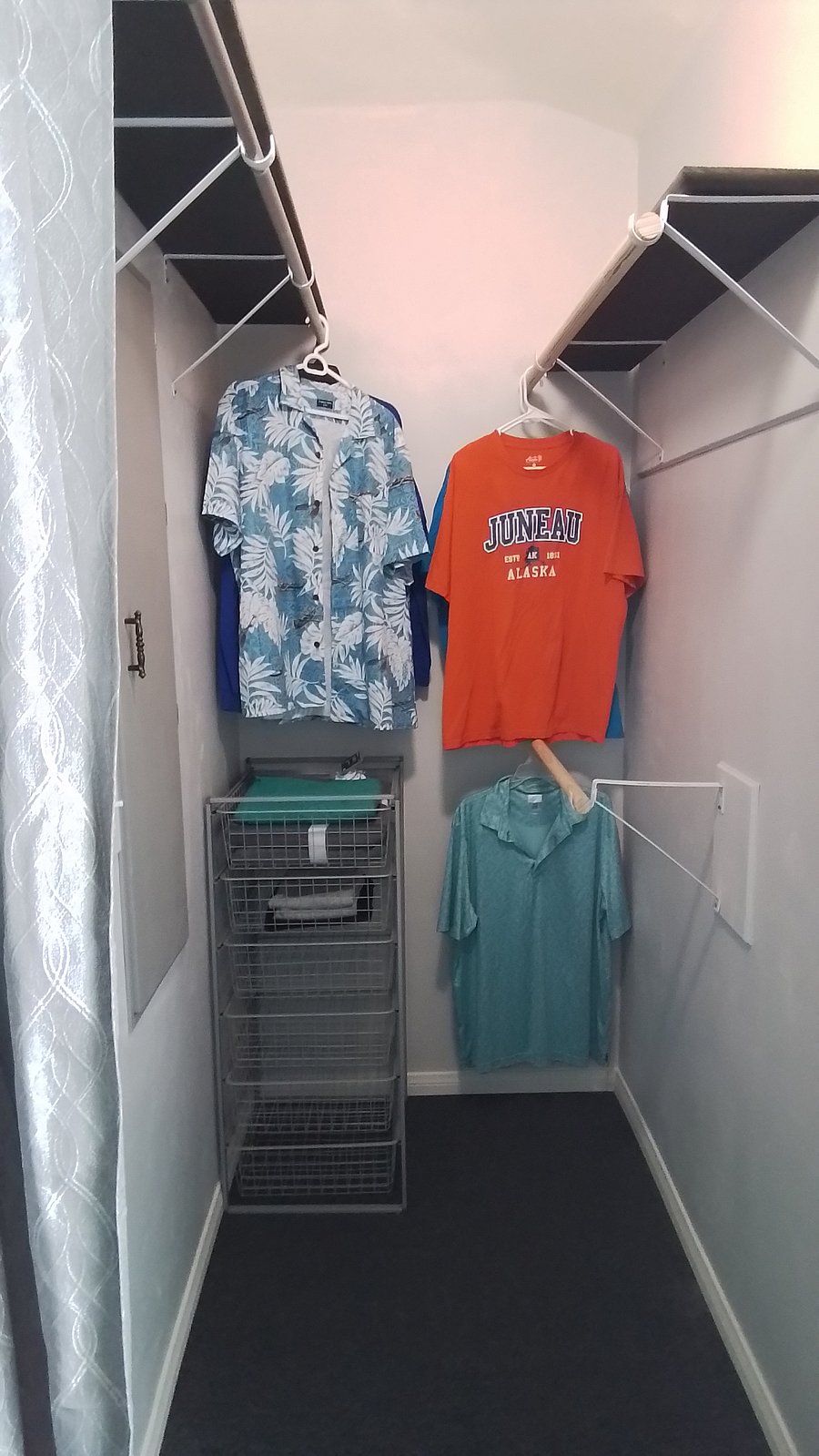 Large walk-in closet with built-in ironing board.