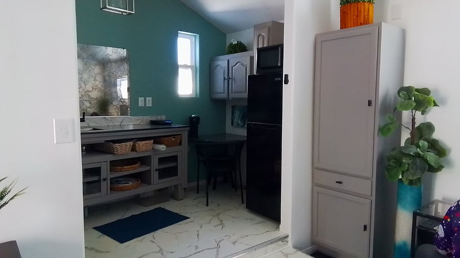 Kitchen and adjacent pantry or storage