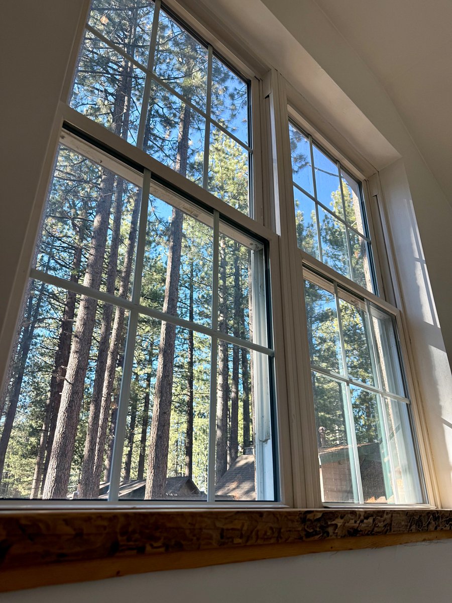 Enjoy the view from the large windows in the stairwell to master bedroom.