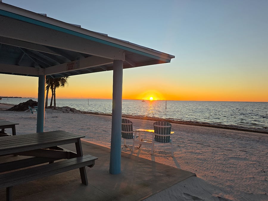 Neighborhood beach with cabanas and bathrooms.