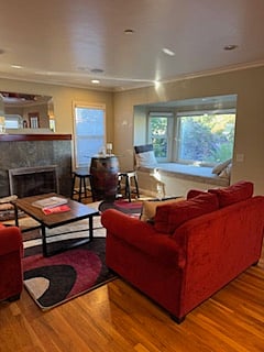 Living Room with outdoor view showing a lovely window seat.