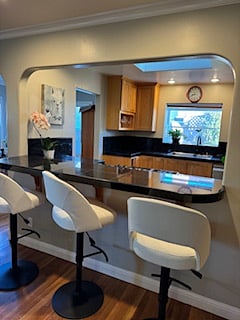 Bar Stools adjacent to Living Room