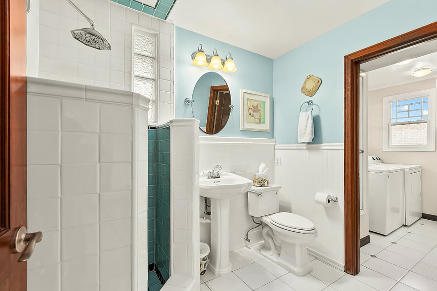 Downstairs Bathroom with Shower Retains 1020s Character with Separate Laudry Room.