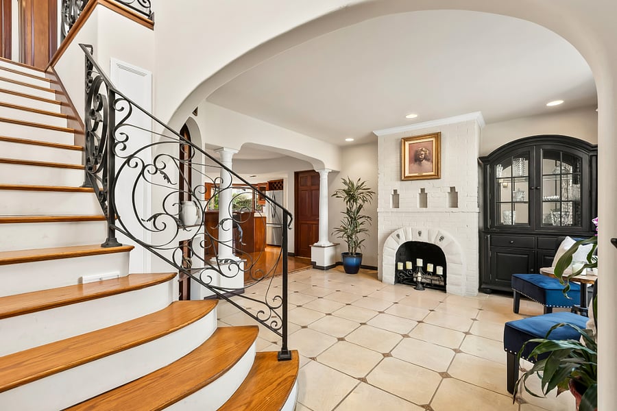 Enter beautifully renovated home with elegant archways and french windows.