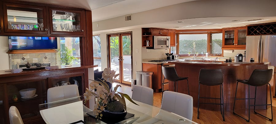Open floorpan leading from Living Rm to Kitchen, Dining Room and Family Room