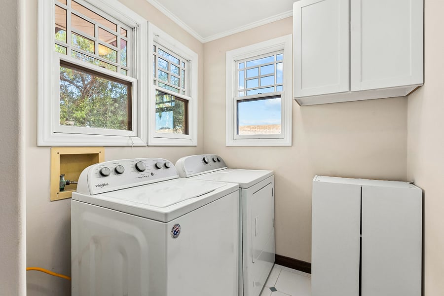 Separate Laundry Room with Large Capacity Washer and Dryer Plus Storage