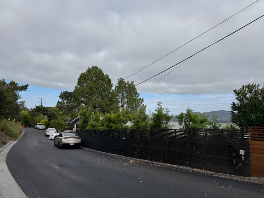 Lots of safe and free parking right in front of the house (darker fenceline, and beyond).