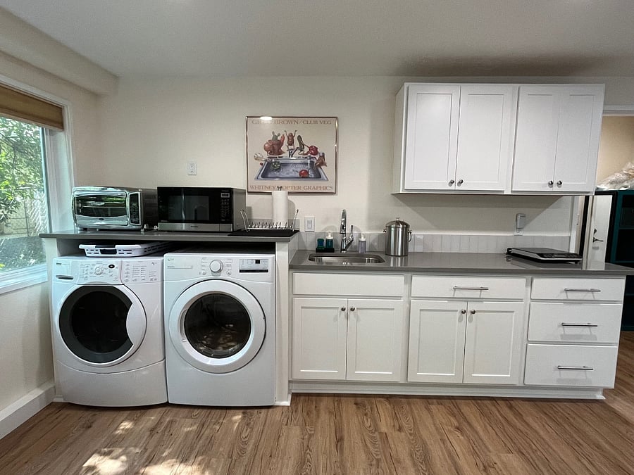 Kitchenette with full-size washer & dryer, convection-toaster-oven, full-size 1200W microwave, induction hot plate, fully stocked kitchenette, full-size fridge