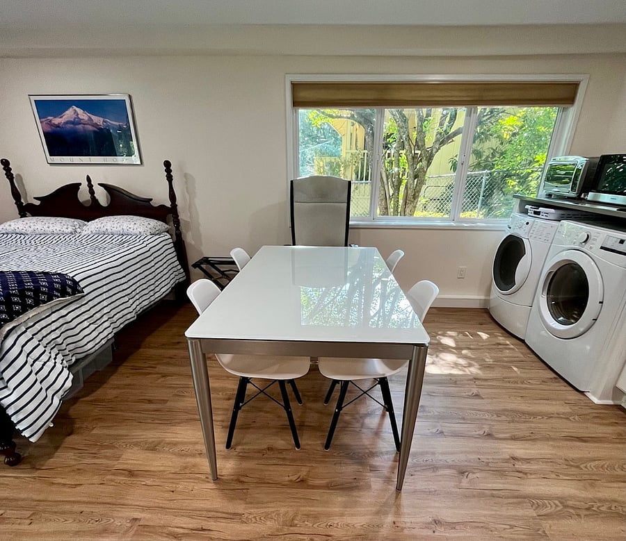 6-person glass top table with 4 MCM chairs