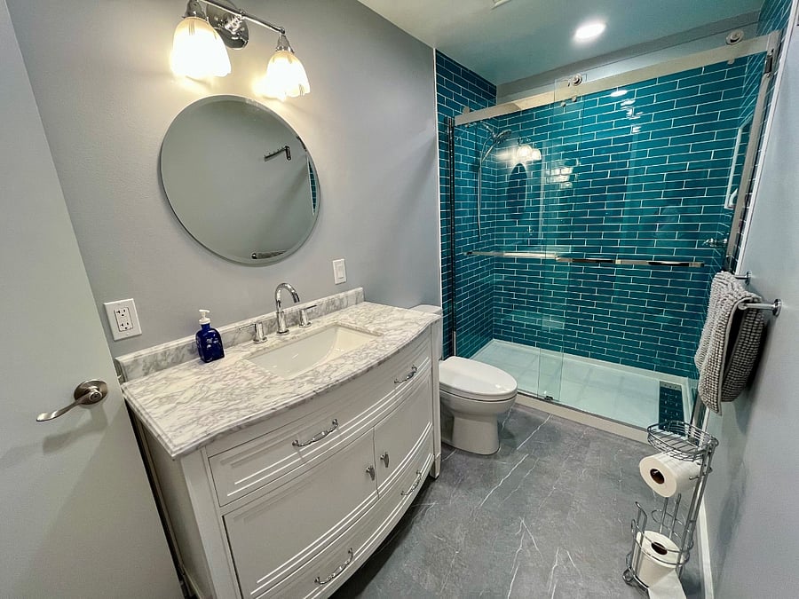 New bathroom with all new floors, flooring, vanity, lighting, fan, sink, and double-wide tile shower
