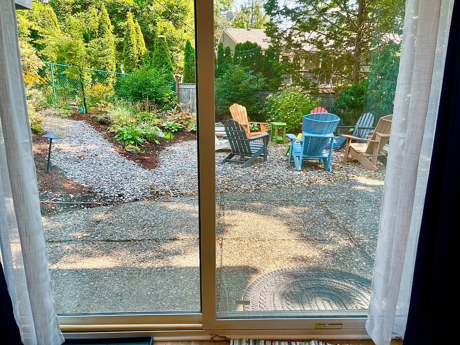 View of outside studio entrance from inside studio (has both sheer and black-out shading).