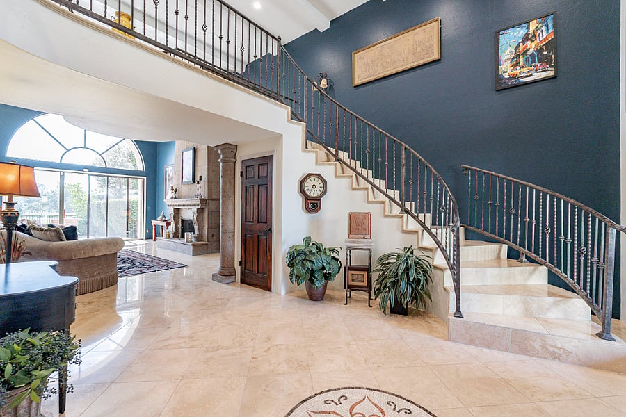 Entry way into spectacular high ceilings and a lake view