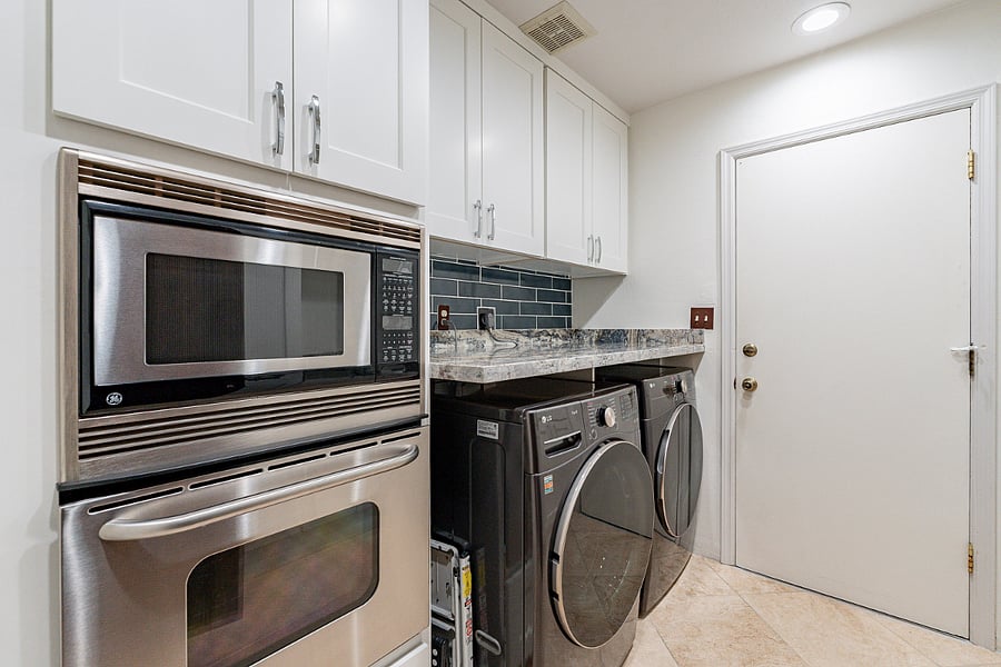 Laundry room, prepkitchen for entertaining including an additional mircrowave and oven