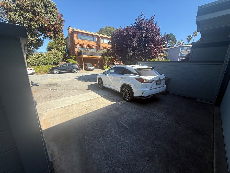 Private parking spot. Hose to wash your car.