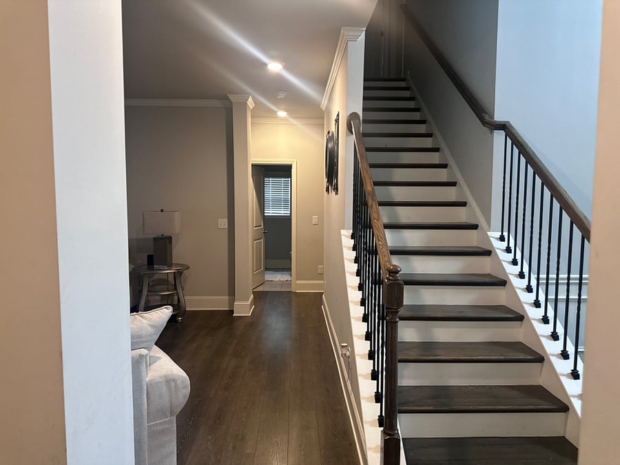Hallway leading to downstairs full bathroom which is also available to renters.