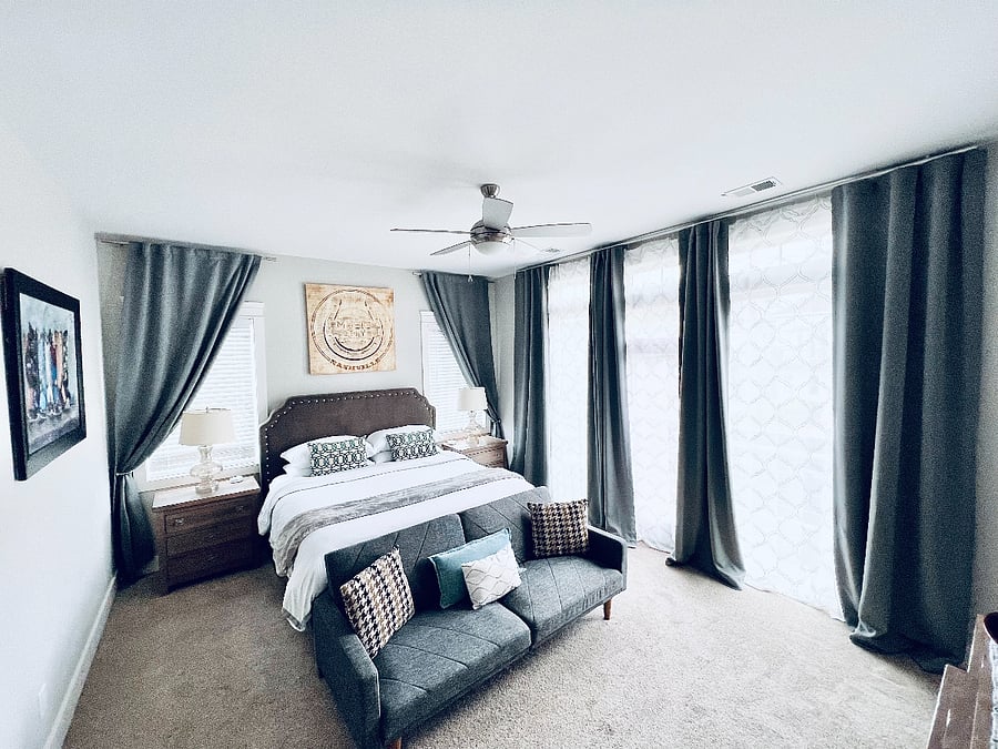 Spacious bedroom 1 - King Bed, pull out sofa, large windows with walk out balcony