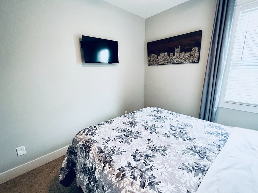 Another view of bedroom 2 with TV