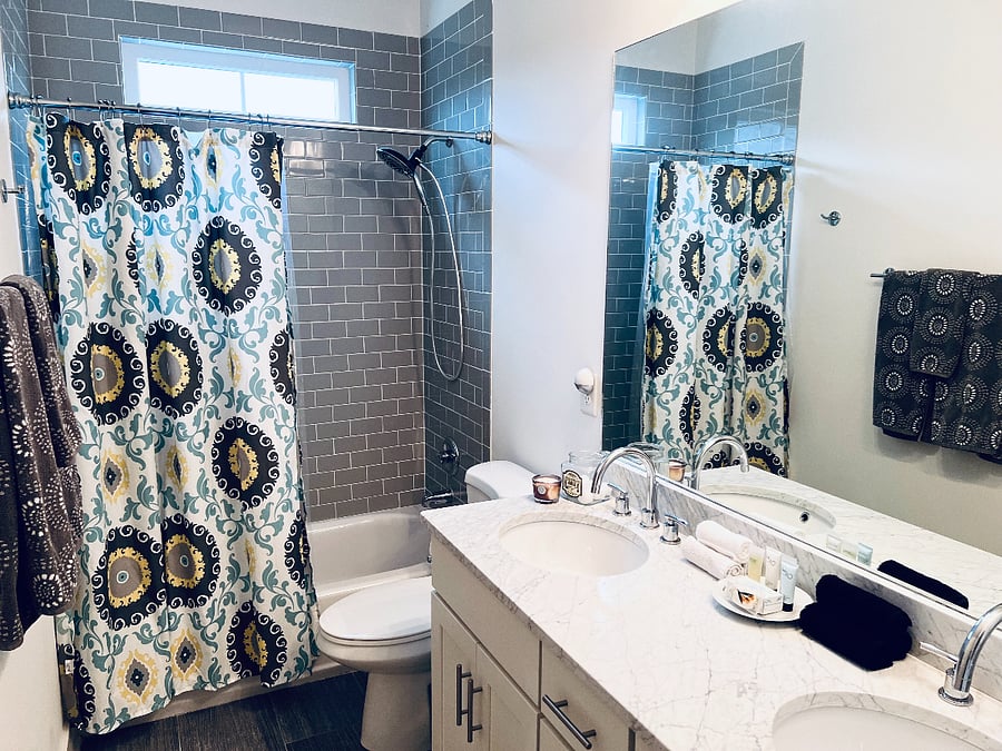 2nd floor bathroom with shower and double vanity