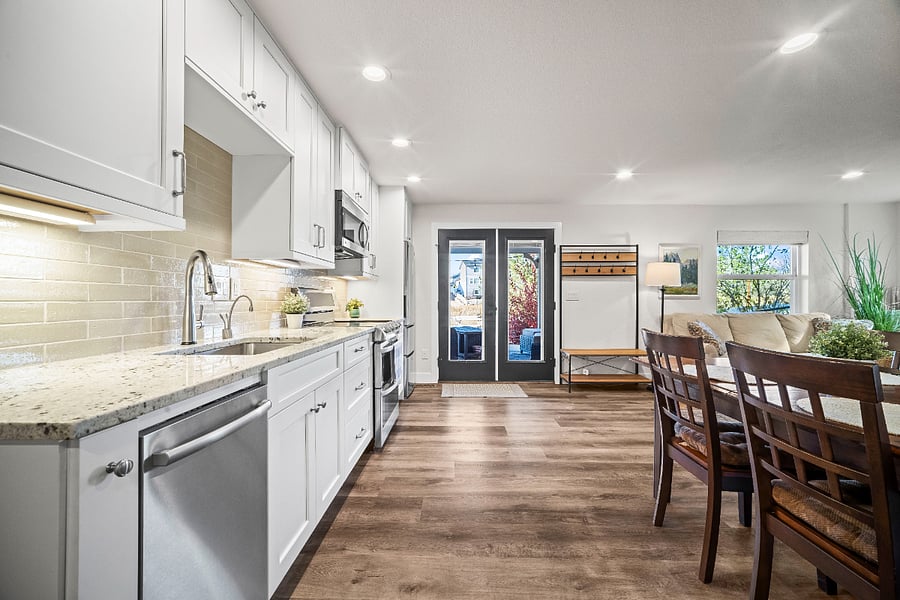 Full kitchen with stainless appliances, filtered instant hot water, an ice maker, and direct access to the private patio entrance.