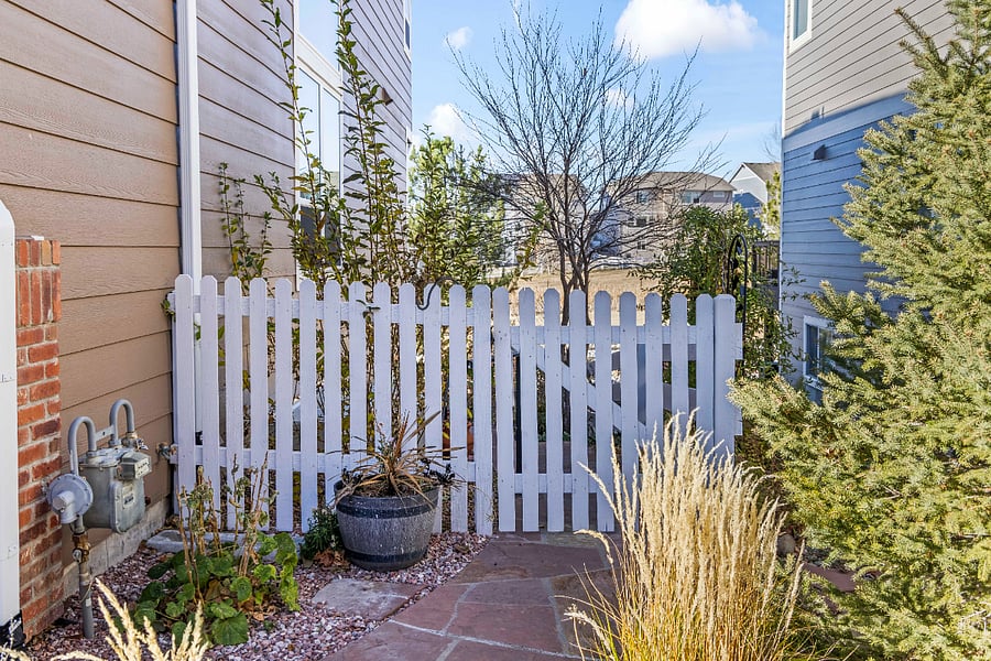 Gated side entrance providing a private pathway to the suite.