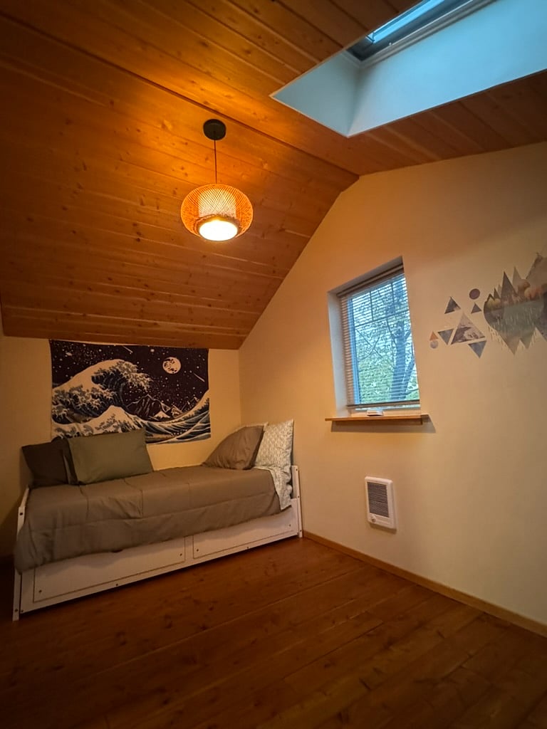 north bedroom with twin daybed that pulls out to be a double twin bed