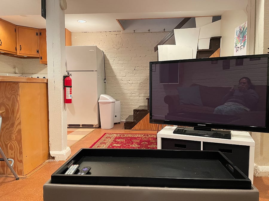 Living room with TV and seatingperfect for unwinding after long workdays.