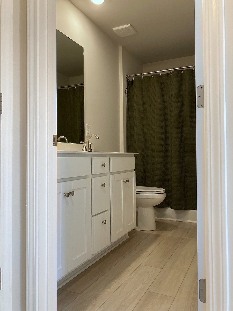 Full bathroom off the second floor hallway includes a shower and bathtub