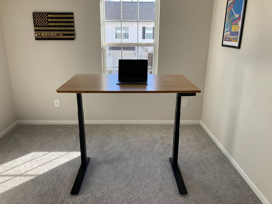 The third bedroom has been purposed as an office for remote work. A beautiful place to work with natural light and appealing art.
