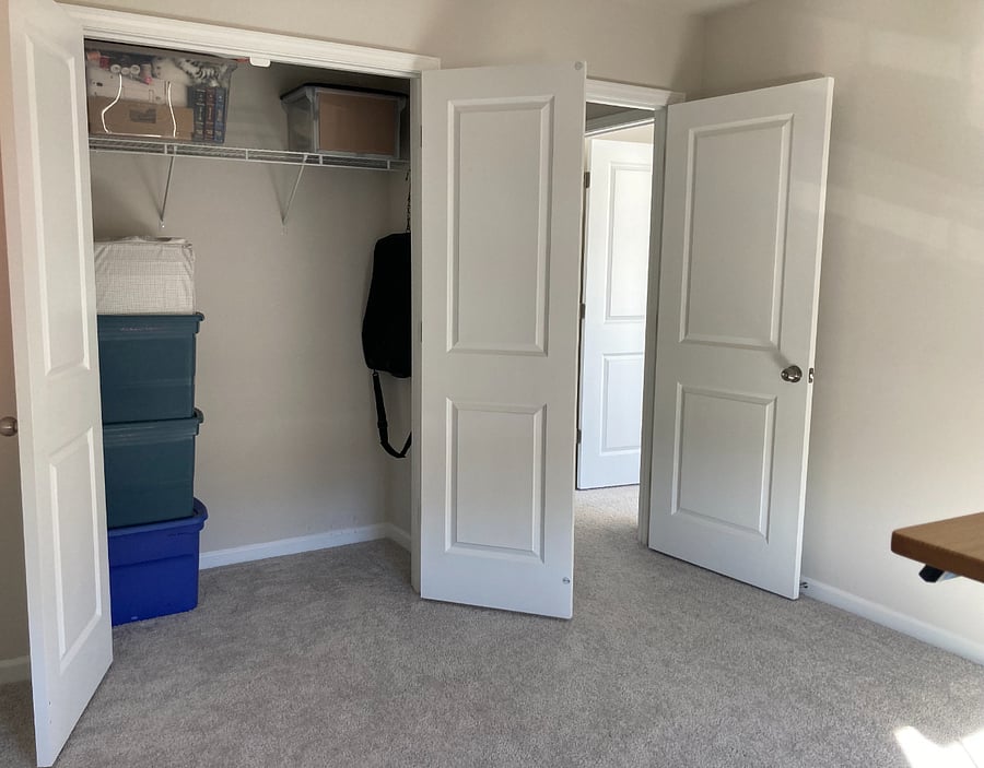 A convenient closet for storing office items or seasonal household decor.
