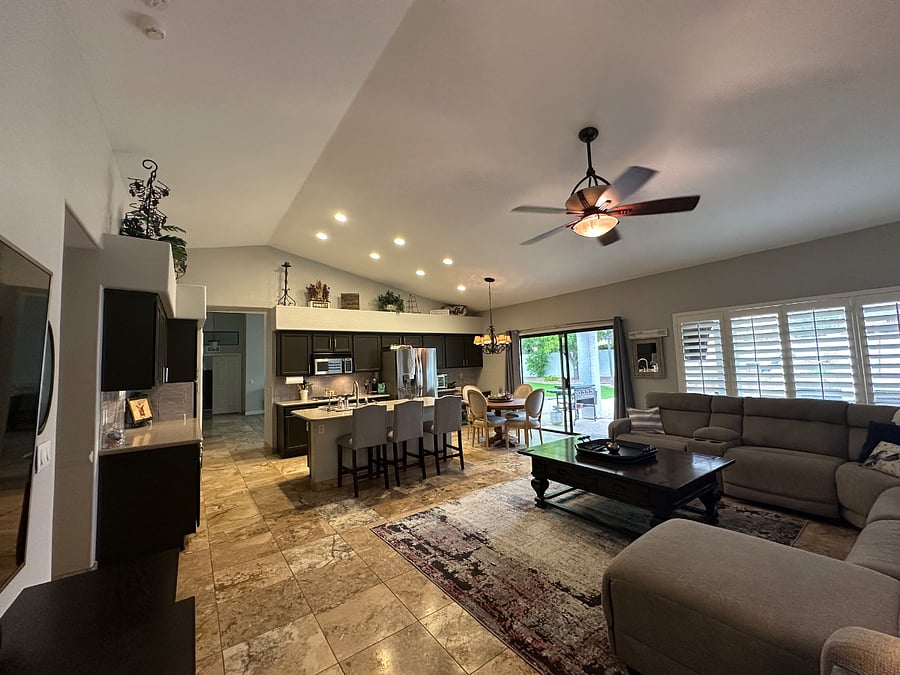 FAMILY ROOM AND EAT IN KITCHEN AREA WITH GAS STOVE. 75IN SMART TV
