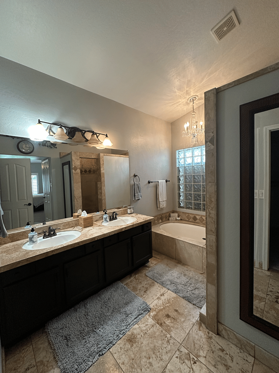 MASTER BATHROOM WITH DOUBLE VANITIES, GARDEN TUB AND WALK IN SHOWER WITH DOUBLE SHOWER HEADS