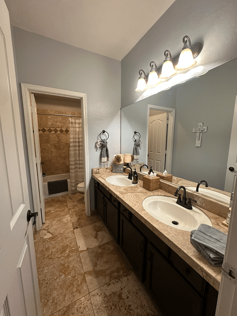 BATHROOM WITH TUB SHOWER AND DOUBLE VANITIES