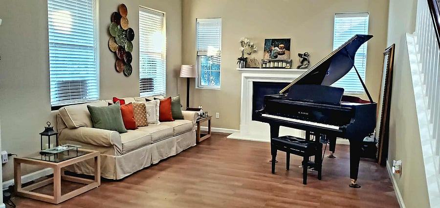 Cozy living room with a gas-burning fireplace, luxury vinyl plank flooring throughout the entire house.